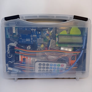 Arduino Starter Kit - clear plastic carrying case containing an Arduino Uno board, an LCD screen, a remote control, jumper wires, and components.