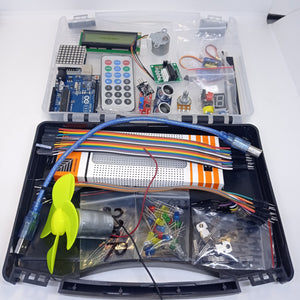 Arduino Starter Kit - shown in an open black plastic case containing an Arduino Uno board, LCD screen, remote, breadboard, jumper wires, motor, and LEDs.