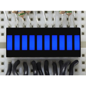 Blue 10 Segment Light Bar Graph LED Display - ten illuminated blue rectangular segments mounted on a white breadboard with connected wires.