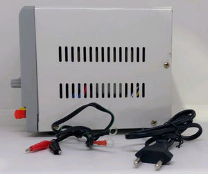 Buy Ps 303A Volder 30V 3A Variable DC Power Supply – Digilog.pk - side view showing a white metal casing with ventilation slots, a knob, red and black terminals, and cables.