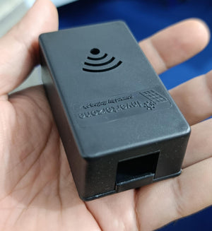 Casing For Inverterzone WiFi Dongle - shown in a hand, featuring a black rectangular plastic shell with a WiFi icon, text, and an RJ45 port.