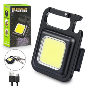 COB Rechargeable Keychain Flashlight | Mini Small Flashlight With 3 Light Modes, Folding Bracket, Bottle Opener, And Magnet Base For Fishing, Walking, - shown with its retail box, a USB charging cable, and a keychain attachment, featuring a black carabiner frame.