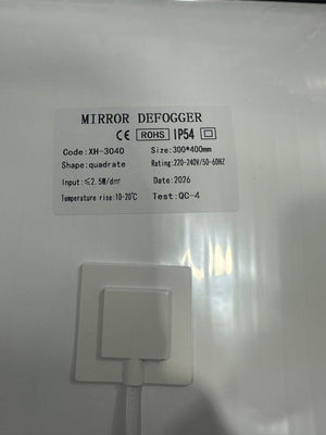 Customizable 300*400mm Bathroom Mirror Heating Pad Pet Electronic Defogger Film For Smart Mirror 220V Factory Direct - a white rectangular heating pad showing a product label with specifications including size, voltage, and IP54 rating, with a power cord.