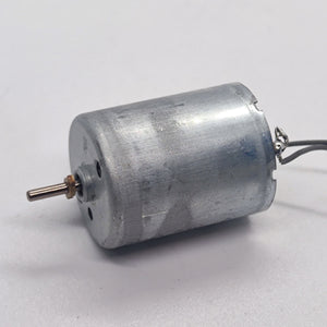 DC 2V To 24V 5100 RPM High Torque Mini Micro Motor DC Motor - a silver cylindrical DC motor with a metal shaft and two attached electrical wires.