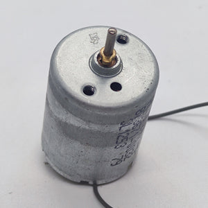 DC 2V To 24V 5100 RPM High Torque Mini Micro Motor DC Motor - a silver cylindrical motor with a metal shaft and two thin wires extending from the base.