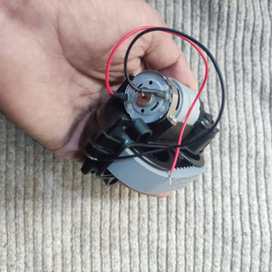 DC Gear Motor With 3.7V To 12V Operated - shown as a close-up of the silver motor housing with red and black wires connected to the terminals.