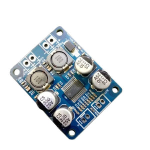 Digital 2 Channel Mono Audio Amplifier Board Module TDA3118 - a blue rectangular circuit board featuring four capacitors, two inductors, and a central chip.