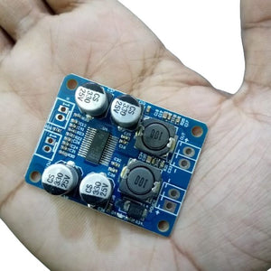 Digital 2 Channel Mono Audio Amplifier Board Module TDA3118 - a blue circuit board with four capacitors and two inductors.