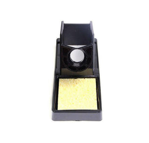 Digital Soldering And SMD Rework Station Kada 852D+ - shown as a black plastic soldering iron stand with a rectangular yellow cleaning sponge.