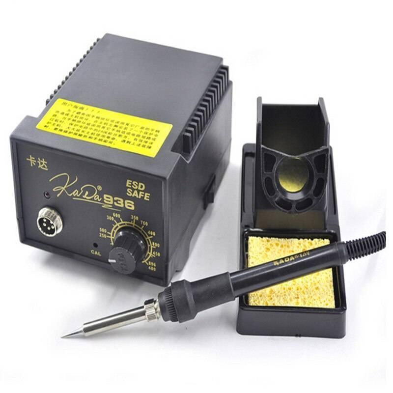 Digital Soldering Iron Station Kada 936D+ ESD Safe - a black control unit with a circular temperature knob and connector port, a soldering iron, and a stand.