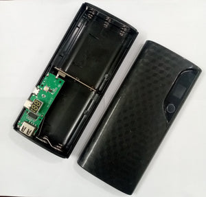 Solderless LCD Display Dual USB DIY Power Bank Module - shown as a black, open plastic case with a green circuit board, two USB ports, and an LCD screen.