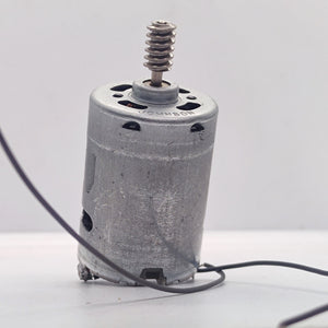 DIY DC Motor DC 3V To 25V Torque Mini Motor 17500RPM - a silver cylindrical motor with a metal worm gear on the shaft and two attached black wires.