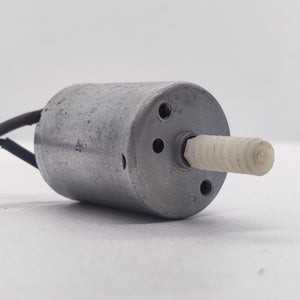 DIY Mini 5vdc DC Motor - shown as a silver cylindrical motor with two black wires and a white plastic worm gear attached to the rotating shaft.