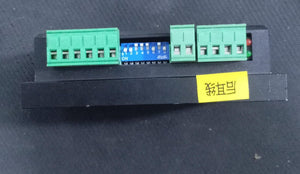 DM545-IO 18-50V/DC 4.5A 2-phase Stepper Motor Driver - a black rectangular module featuring green terminal blocks, a blue 8-position DIP switch, and two small status LEDs.