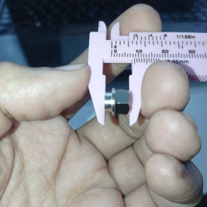 Eccentric Sleeve Type A 8X6 Spacer Eccentric for structural profile under V-slot OpenBuilds 6 mm engraved - a close-up showing the silver metal spacer being measured by a pink plastic vernier caliper.
