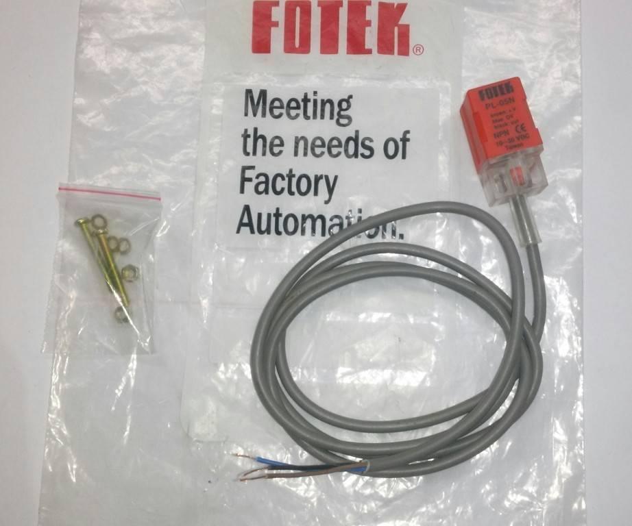 Fotek Proximity Sensor PL-05N 5mm NPN Out DC10-30V IP67 - shown with its grey cable, a small bag of mounting hardware, and the branded plastic packaging.