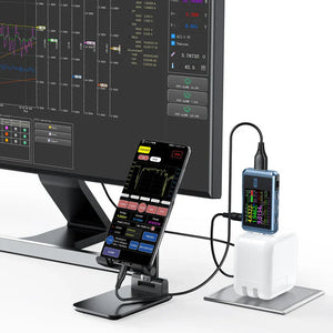 Fr FNB48P Bt USB Tester Price - shown connected to a white power adapter and a smartphone, displaying real-time voltage, current, and power data on its screen.