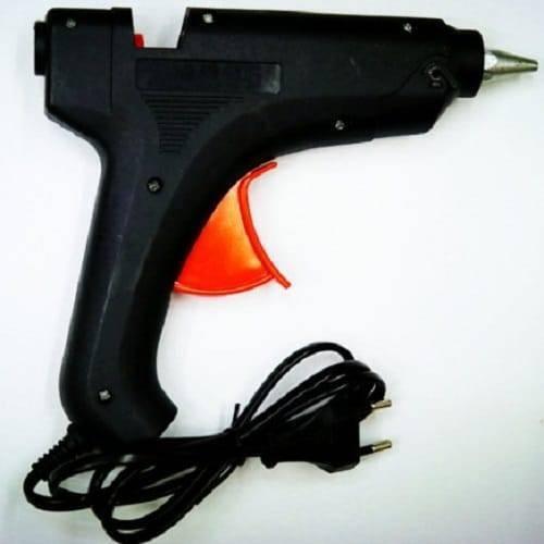 Glue Gun For 11mm Glue Sticks 80W 50/60Hz - a black hot glue gun with an orange trigger and an attached black power cord with a two-pin plug.