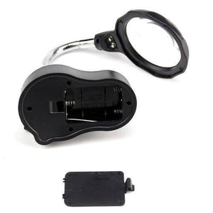 Helping Hand Clip Desktop LED Light Magnifier Glass With Soldering Stand 3.5x 12x - the black base with an open battery compartment and its detached cover, connected to a flexible arm.