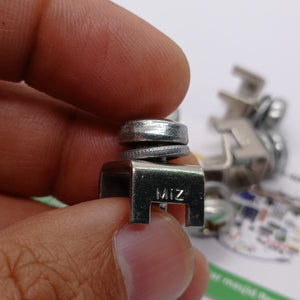 High Current Screw Terminal Connector - a close-up view of a silver-colored metal clamp component with a screw and the text MIZ stamped on its side.