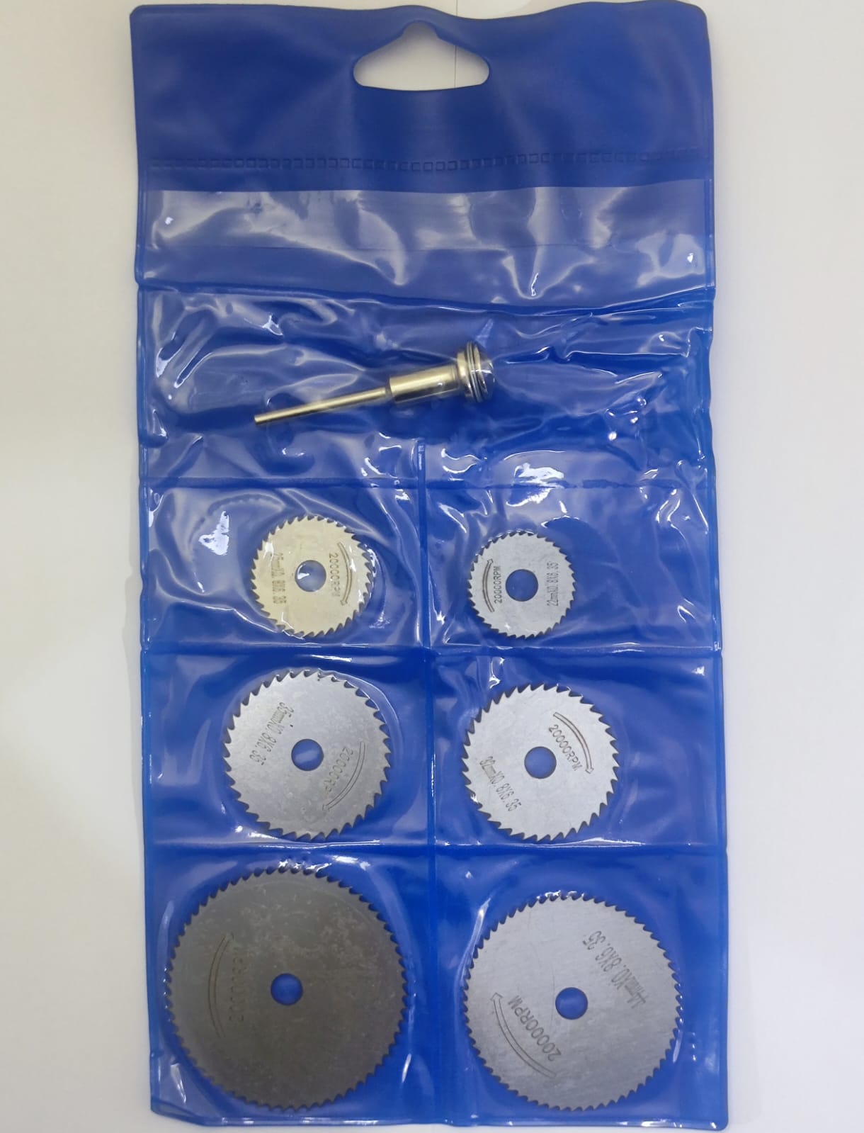 Hss Circular Saw Blade Set For Metal & Dremel Rotary Tools - shown in a blue plastic storage pouch with six circular blades and one metal mandrel.