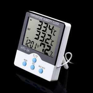 Htc-2A Htc2a Digital Clock Electronic Temperature Hydrometer Thermometer - humidity clock in white and black, showing 33.4°C, 33.2°C, 12:01 AM, and 72% on the display with three blue control buttons.