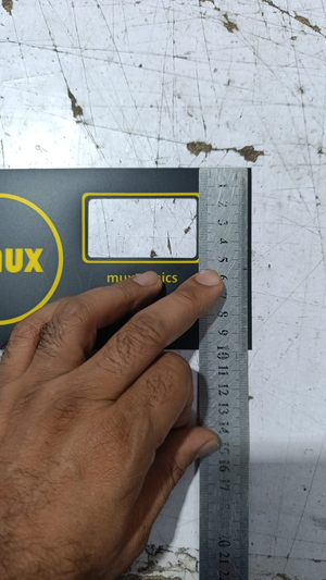Hybride LCD Sticker Idm-7 Sticker For Graphical LCD Based Local Solar Inverter - a black rectangular overlay being measured by a metal ruler.