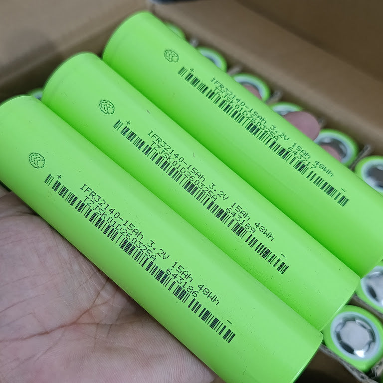 IFR32140 LiFePO4 Battery Cell 3.2V 15Ah 15A - Grade A Fresh Stock - three cylindrical, light green battery cells held in a hand with printed specifications and barcodes.