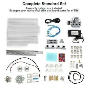 Imported CNC Engraving PCB Milling Machine Wood Carving CNC 3018 - a flat-lay of all disassembled components, aluminum profiles, motors, and hardware.