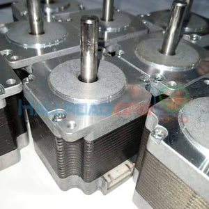 Japanese NEMA23 2.2A Stepper Motor Compatible With TB6560, DRV8825 Torque 9.69 Kg.cm - a top-down close-up view of several silver and black square stepper motors with protruding metal shafts.
