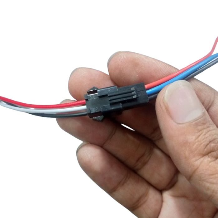 JST Sm 3 Pins Plug Male And Female Wire Connector - a hand holding a connected black plastic 3-pin male and female wire connector with colored wires.