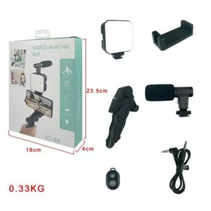 Kd-49/20 Vlog Kit Vlogging Kit Video Making Kit With Microphone - a box with dimensions and its contents: a light, phone holder, microphone, tripod, remote, and cable on a white background.