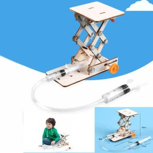 Kids DIY Hydraulic Lift Table Model Scientific Experiment Kit Educational STEM Toy - a wooden scissor lift mechanism connected by a clear tube to a syringe controller.