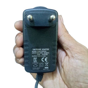 Liitokala 12V 2A 18650 Lithium Battery Charger With DC Plug - a black wall-plug switching adapter held in a hand, showing its input and output specifications.