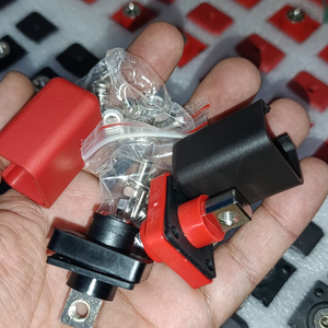 Lithium Battery Power Terminal All-Copper Quick Connector Pair 120A - shown with black and red plastic covers, metal terminals, and a bag of screws.