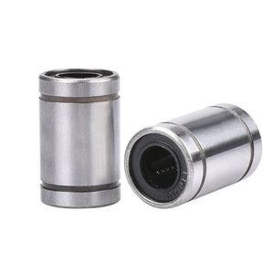 Lm8uu 8mm 8x15x24mm Ball Bearing Bush Bushing For CNC And 3d Printer Pparts - two cylindrical silver metal bearings with black circular inserts standing upright and lying on their side.