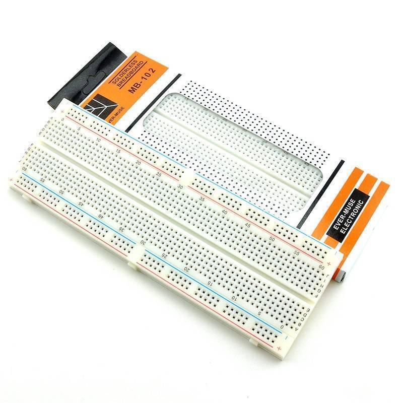MB102 Breadboard 830 Points Solderless Prototyping Breadboard High Quality - a white rectangular plastic breadboard with orange and black branding on its packaging.