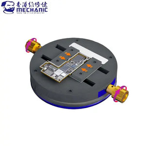 MECHANIC MK1 UNIVERSAL CLAMPING FIXTURE - Repair Fixture - circular grey device holder with two gold-coloured rotating knobs, holding a rectangular circuit board in the center with orange arrow graphics.