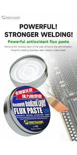 Mechanic Q60 Powerful Antioxidant Flux Paste Enhance The Anti-oxidation Remove Oxidized Layer Flux Paste Soldering Repair Paste 60G - shown as a round metal tin with a blue and white label, next to a blurred image of a circuit board and a metal spatula.