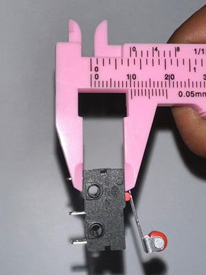 Micro Roller Lever Arm Open Close Limit Switch Micro Switch - shown in a close-up view being measured by a pink plastic vernier caliper, displaying a measurement of 10 millimeters.