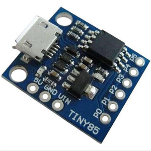 Micro USB Digispark ATTINY85 Mini USB Development Board - a blue rectangular circuit board featuring a micro USB port and six labeled pin headers.