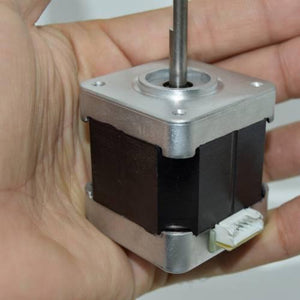 Minebea Japan d Cut Shaft NEMA 17 Stepper Motor For 3d Printer CNC - shown held in a hand, featuring a silver metal frame, black body, and a white electrical connector.