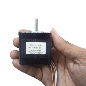 Minebea stepper Motor 17PM-K142-P6WS - the black square motor body, metal shaft, and a label with model details and wires.