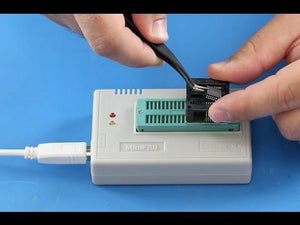 Mini Pro TL866CS USB Bios Universal Programmer - shown with a white USB cable, two status LEDs, and a chip being inserted into a socket adapter.
