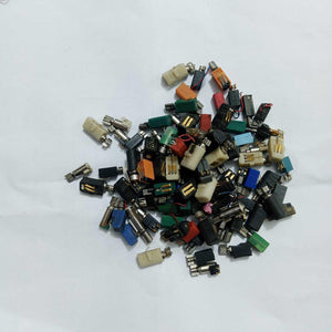 Mini Vibration Motor MT35 3V - shown as a large, scattered pile of various small cylindrical vibration motors with colourful plastic casings and metal tips.