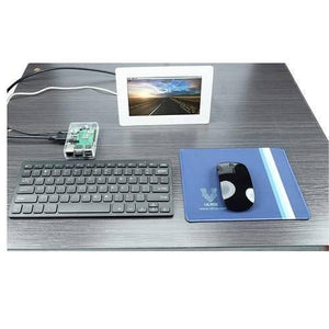 Mini Wireless Keyboard And Mouse For Raspberry Pi - shown with a black keyboard, black mouse on a blue mousepad, and a small screen displaying a landscape.