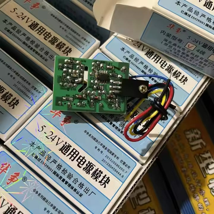 MK4T 5-24 Universal Adjustable Power Module - shown as a green circuit board with a black heatsink and attached red, yellow, and black wires on boxes.