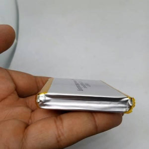 Multipurpose 4600mAh 3.7V Lithium Ion Battery Rechargeable Battery For IOT Robotics And Ev Electric Vehicle - a close-up side profile of the rectangular silver-cased rechargeable battery held in a hand.