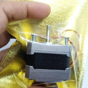NEMA 17 Single Shaft 1.8 Degree Compact Powerful Stepper Motor - shown in a close-up, encased in a gold-coloured protective plastic bag.