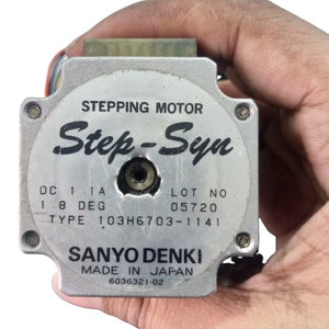 NEMA 20 Stepping Motor – Precision Control for Robotics, CNC & Automation | Digilog.pk - a silver-toned metal stepper motor held in a hand, showing the Sanyo Denki label with model 103H6703-1141 and 1.8 DEG specs.